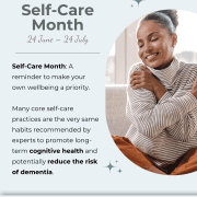 Woman smiling and hugging herself, promoting Self-Care Month and wellbeing.